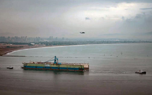Mobile cranes on barges working on the new Lake Champlain bridge